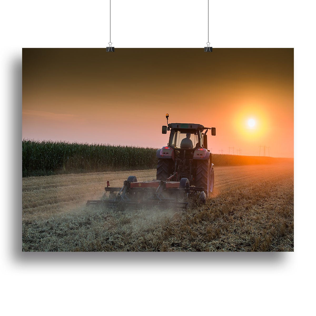 Tractor plowing field at dusk Canvas Print or Poster