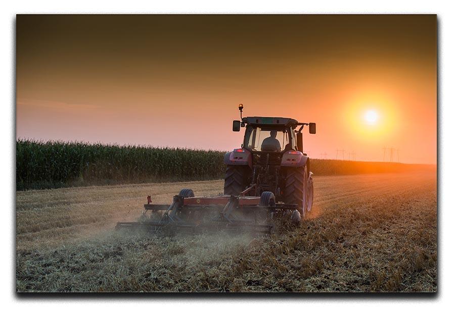 Tractor plowing field at dusk Canvas Print or Poster  - Canvas Art Rocks - 1