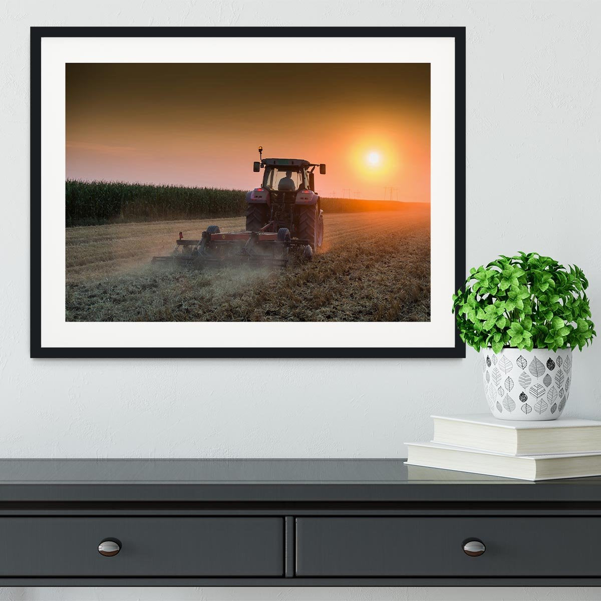 Tractor plowing field at dusk Framed Print - Canvas Art Rocks - 1
