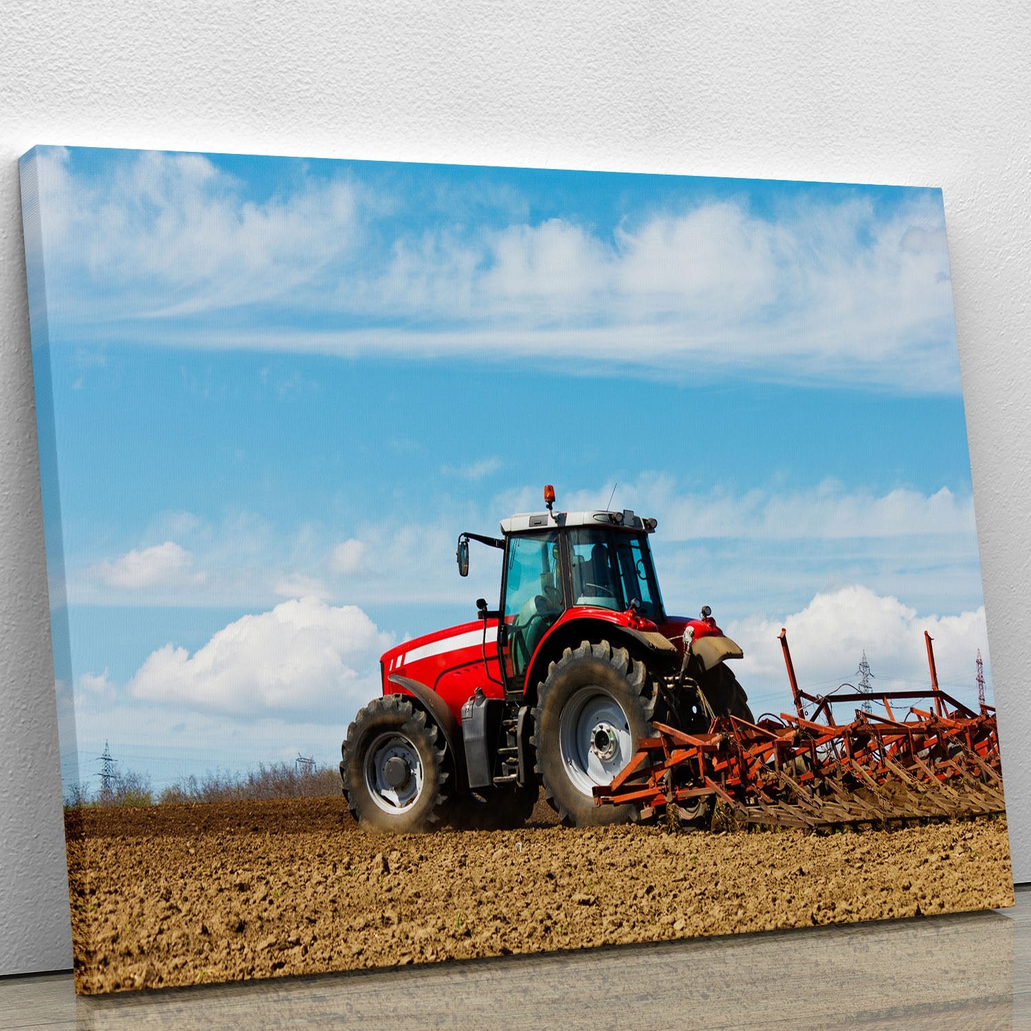 Tractor plowing the field Canvas Print or Poster