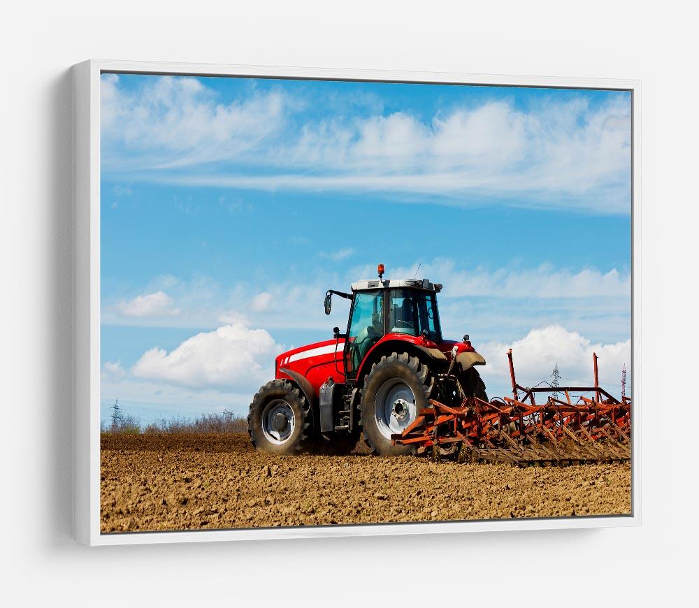 Tractor plowing the field HD Metal Print