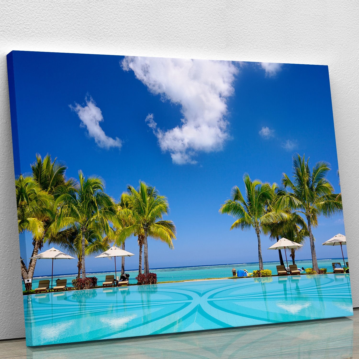 Tropical beach resort with lounge chairs Canvas Print or Poster