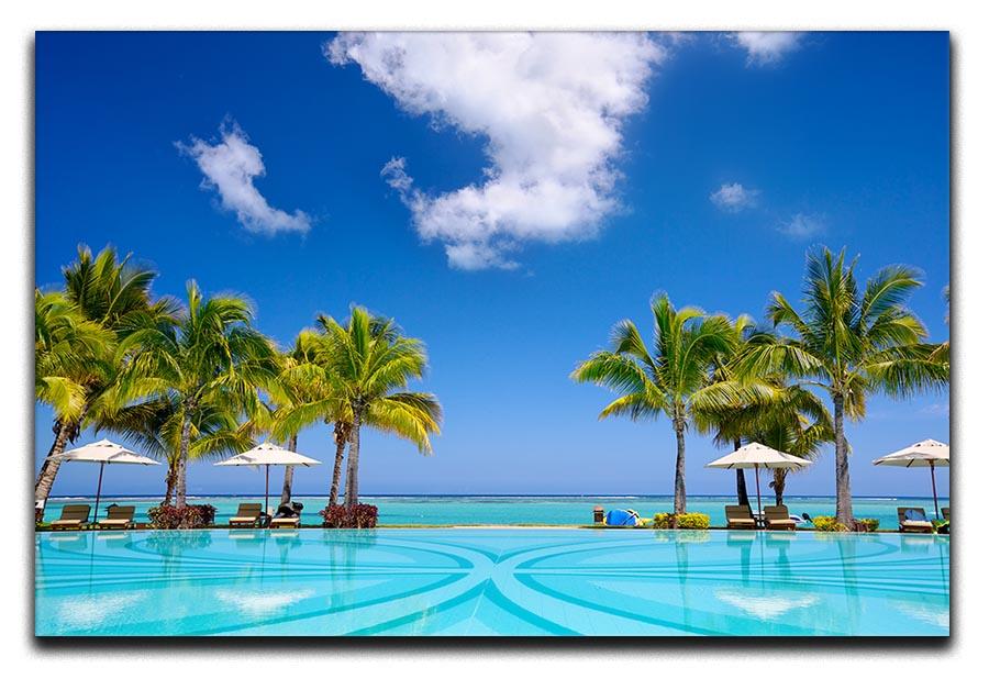 Tropical beach resort with lounge chairs Canvas Print or Poster - Canvas Art Rocks - 1