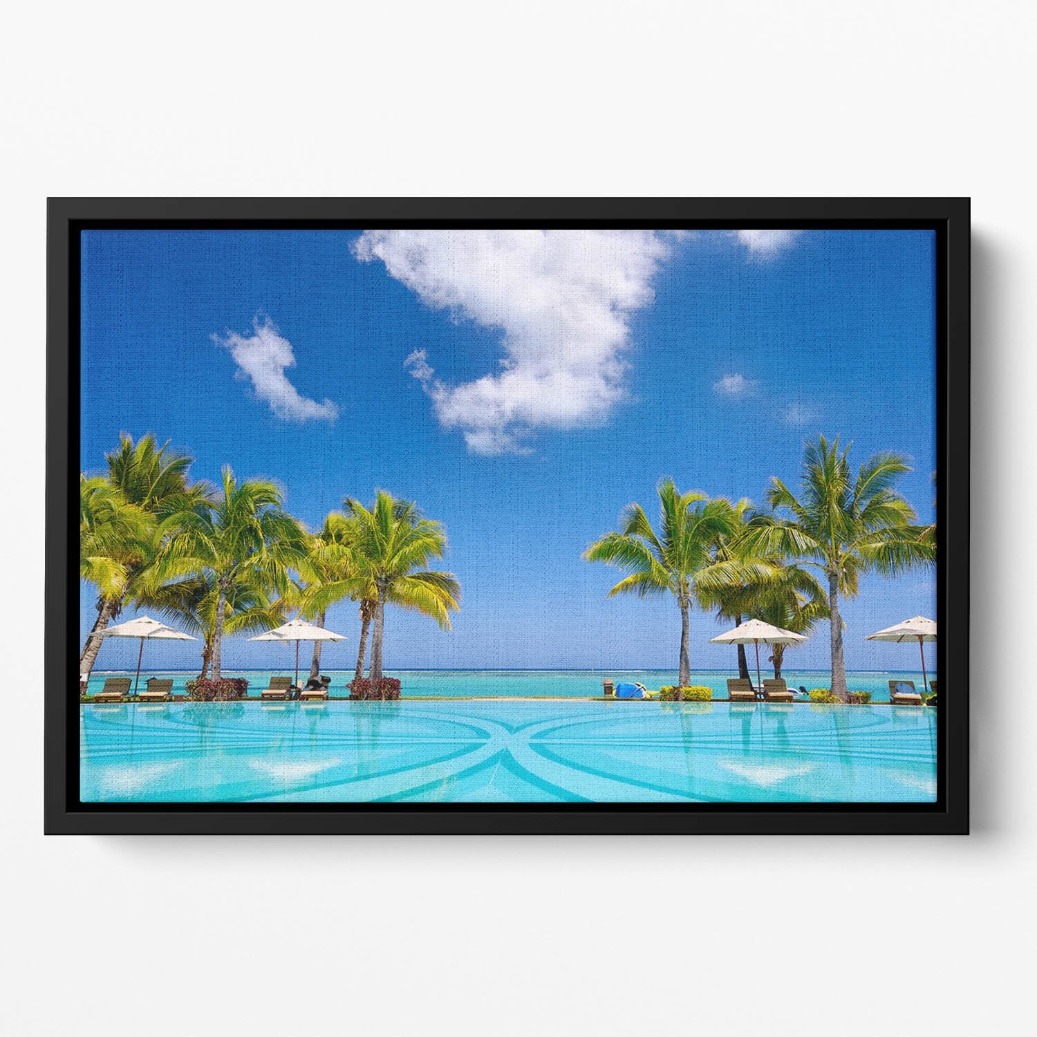 Tropical beach resort with lounge chairs Floating Framed Canvas