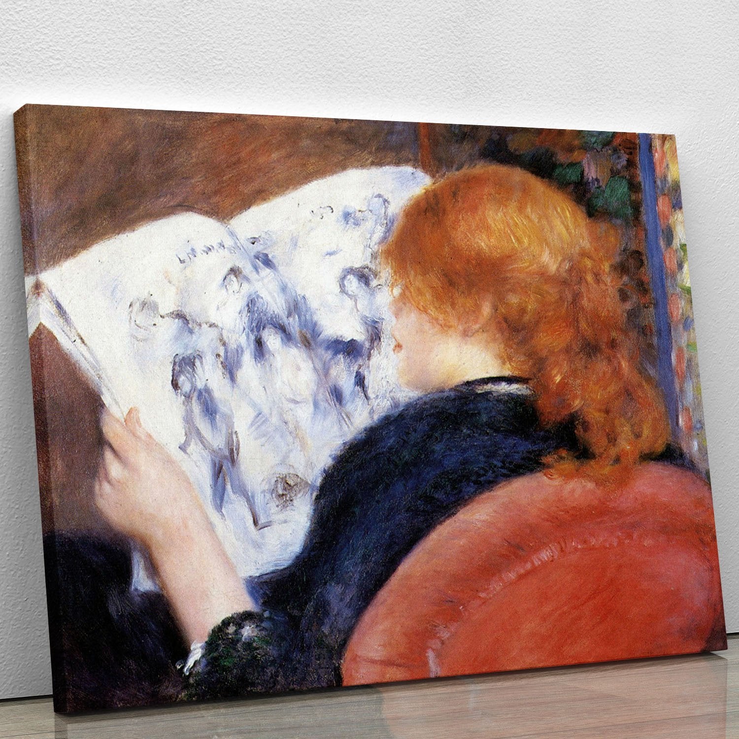Young woman reads illustrated journal by Renoir Canvas Print or Poster