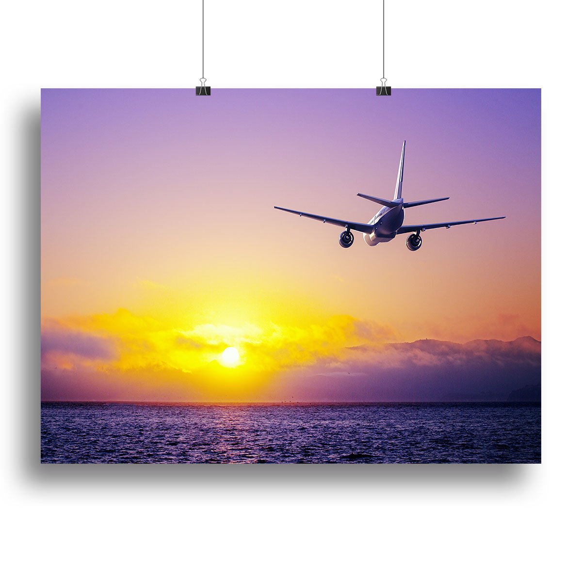 airplane in the sky over ocean Canvas Print or Poster