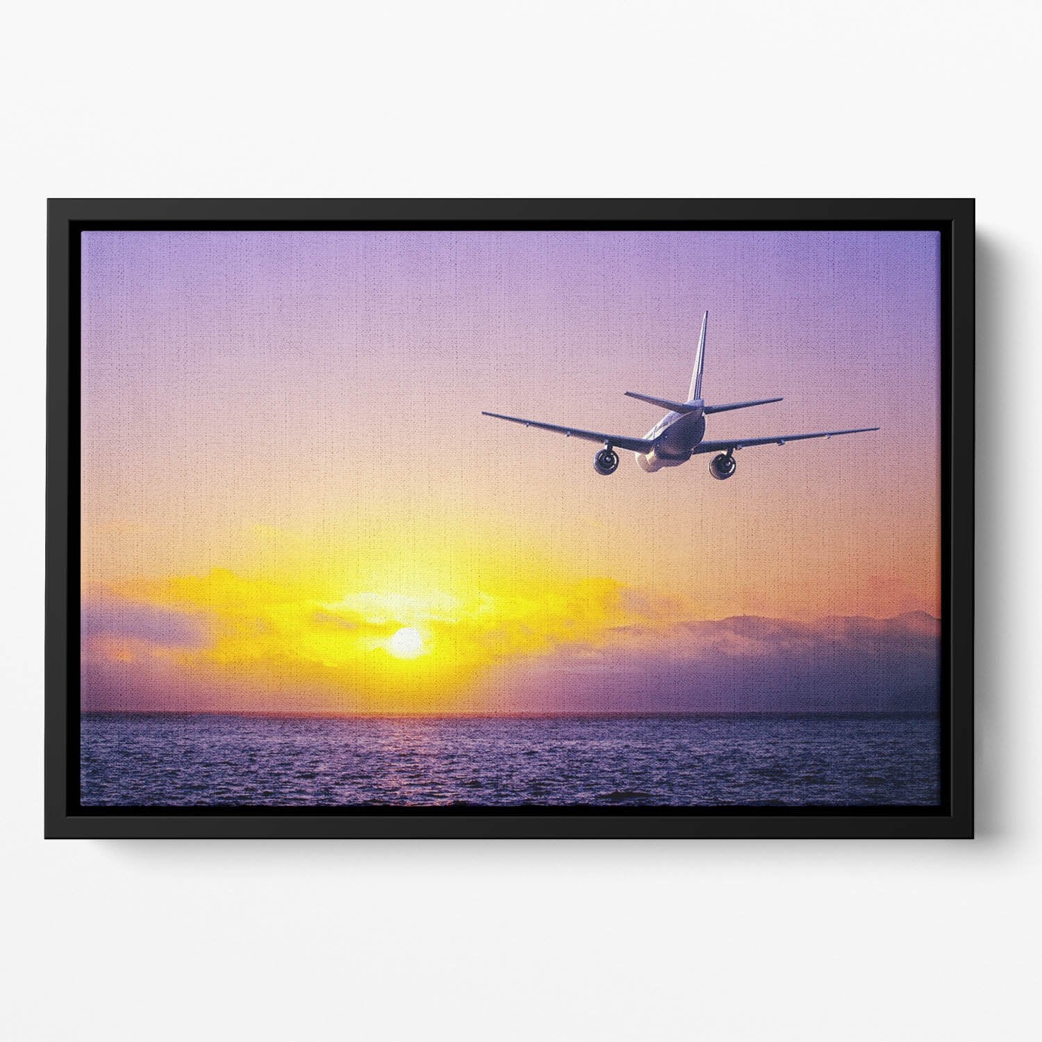 airplane in the sky over ocean Floating Framed Canvas