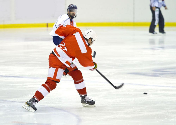 ice hockey player in red Wall Mural Wallpaper